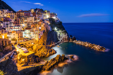 Night view of Manarola. Cinque Terre. It is the second smallest town of the famous Cinque Terre towns. Liguria, Italy. - obrazy, fototapety, plakaty