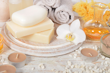 Fototapeta na wymiar natural soap with honey and body oil and a cosmetic face mask with place for tekst