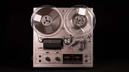 Vintage Reel to Reel tape recorder playing music 
