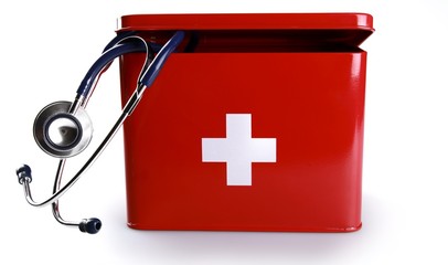 First aid kit with stethoscope - isolated image