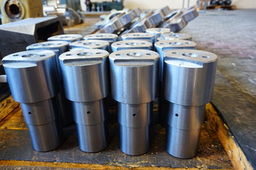 white metal cylindrical parts after machining on the milling and lathe