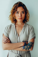 Portrait of sad or serious young woman in studio