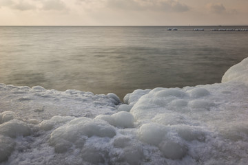 Frozen rocks on the beach by the Baltic sea in Hel, Poland