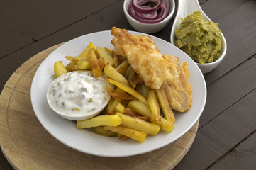 The fish and chips. A traditional English dish.