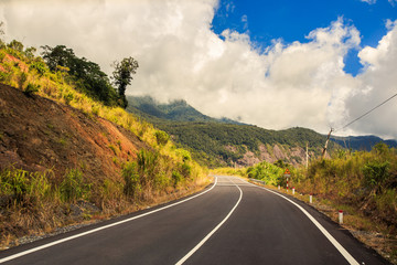 Highway between Rocky Hills Blue Sky