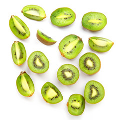Halves and kiwi slices on a white background. Ripe fresh kiwi fruit.
