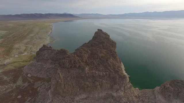 Orbiting Alien Rock and Geyser High Over Desert Lake