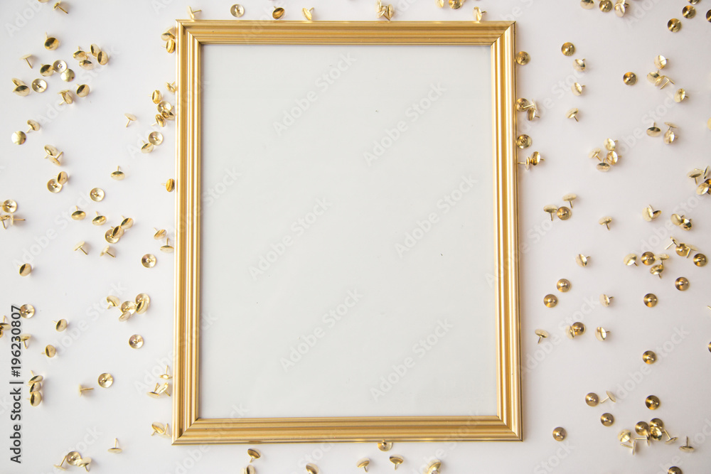 Wall mural gold frame and objects on white background