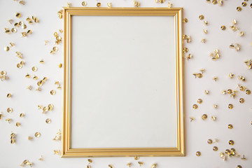 Gold frame and objects on white background