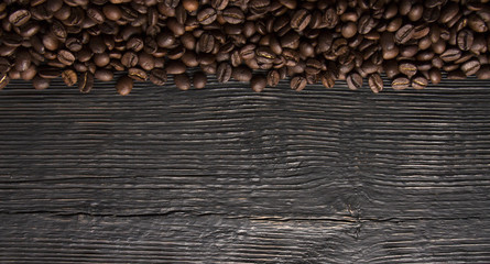 roasted coffee beans on wood texture