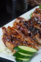 japanese cuisine. grilled chicken on the background