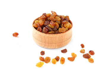 Fototapeta na wymiar Wooden bowl with brown raisins on the white background. Dried grapes.