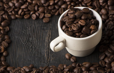 clay cup with coffee on the background of grains