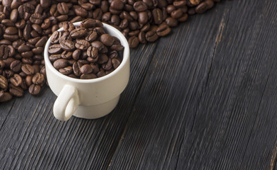 clay cup with coffee on the background of grains