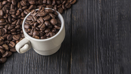 clay cup with coffee on the background of grains