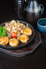 japanese cuisine. grilled shell fish on the background