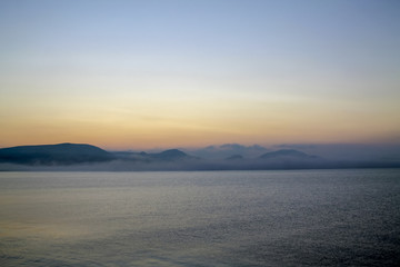 Fototapeta na wymiar Dawn over the black sea, mountain horizon