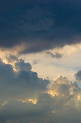 Landscape with dramatic light - beautiful golden sunset with saturated sky and clouds.