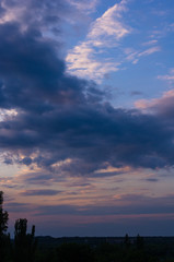 Fototapeta premium Landscape with dramatic light - beautiful golden sunset with saturated sky and clouds.