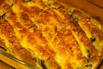 baked In the oven homemade pie stuffed with cheese and mushrooms