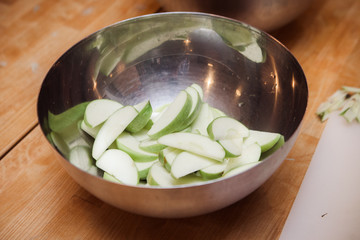 Apples sliced on wood table
