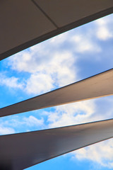 triangle modern luxury awning with blue sky and sunshine reflection