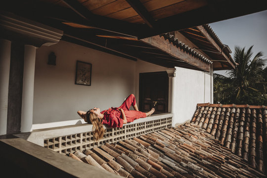 Young woman relaxing on terrace