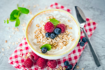 Yogurt with blueberry, raspberry and oatmeal flakes