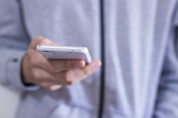 close-up of hands with mobile phone