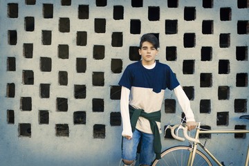 Fototapeta na wymiar fashion teenager with bike in city street