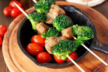 Vegetarian kebabs with seitan and broccoli on a skewers.