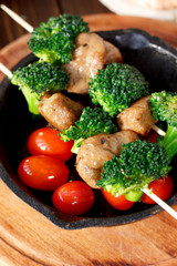 Vegetarian kebabs with seitan and broccoli on a skewers.