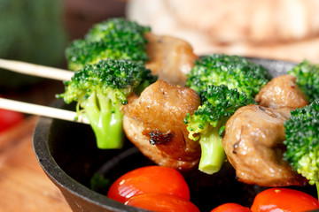 Nice meat kebab with broccoli on skewers