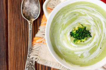 Beautiful vegetarian brocoli soup in a white bowl.