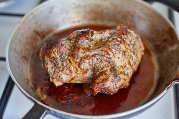 juicy steak in a frying pan