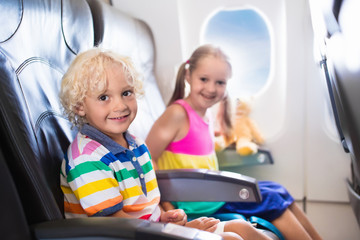 Kids flying airplane. Fligh with children.