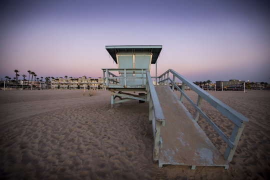 A beautiful sunset sky over a lifeguard shack in Hermosa Beach, California.