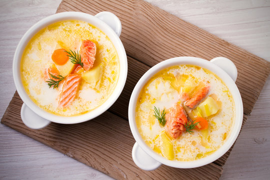 Salmon soup. Two bowls of creamy salmon fish soup. Clean eating, healthy and diet food concept