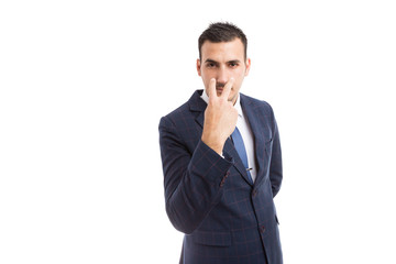Broker banker or entrepreneur making pay attention gesture.