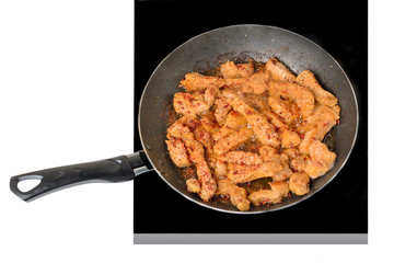 Cooking, fried meat in a frying pan, isolated on white background
