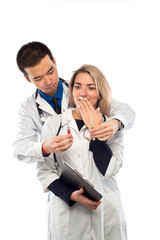 Studio portrait of young doctors in uniform