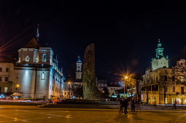 Fototapeta premium Scenic night Lviv cityscape architecture on the long exposure