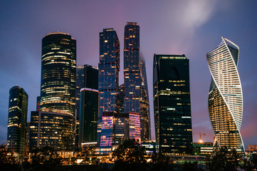 Fototapeta na wymiar Moscow city towers in the night time. Business buildings.Beautiful futuristic city view. Famous touristic place in Russia. Archirecture skycrappers. Urban modern houses. International business center.
