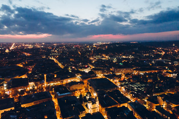 Fototapeta na wymiar panoramic view of old european city on twilight with red sky. bird's eye view.