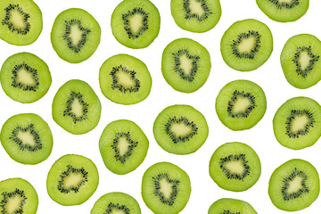 Green slices of kiwi fruit isolated on white background, overhead shot. Sliced kiwi photographic...