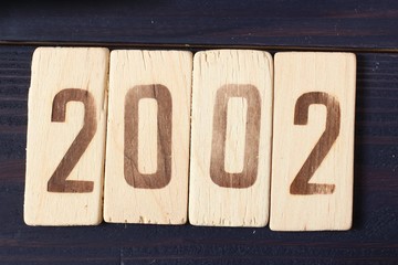Retro wooden figure year 2002