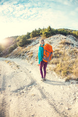 A girl with a backpack.