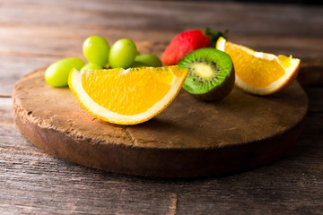 Fresh fruits on wooden background