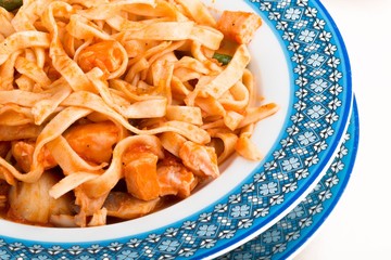 Bowl of chicken and fettuccine dish