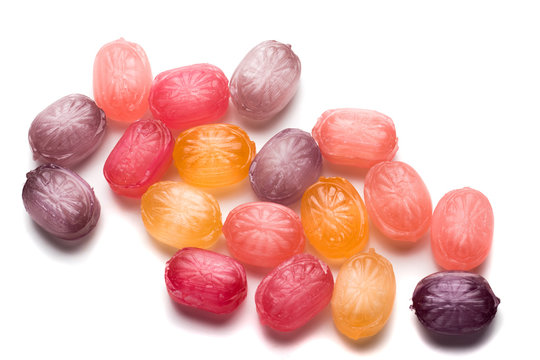 Hard candies over white background